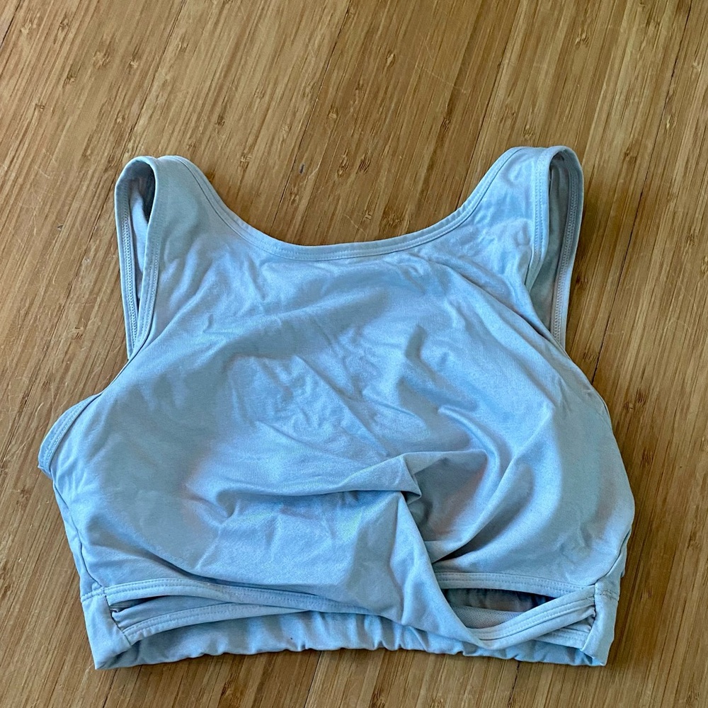 Women’s Zella, cream sports bra. High neck and twisted style. Size medium.